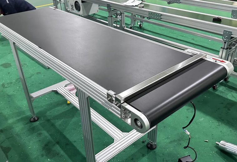 Optimizing Industrial Flow: Why Flat Belt Conveyors are the Heart of Modern Automation