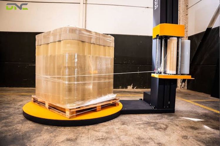 Turntable vs Rotary Arm Stretch Wrapper | DNC Automation 2 Load Profile: The Property That Decides Rotation Before Volume Does